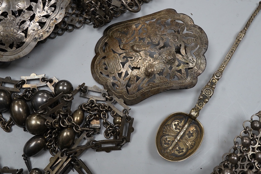 A collection of accessories and a silver spoon, comprising: a Victorian necklace, second half 19th century, composed of a series of links suspending graduated chain festoons and spherical and oval links with pointed pend